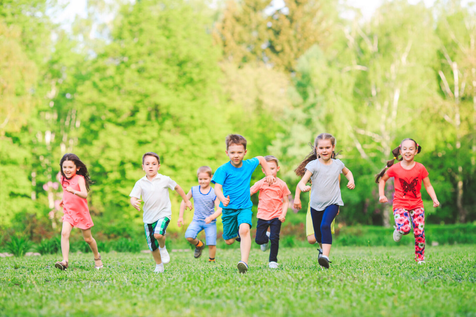 A group of children enjoying outdoor activities in a park.